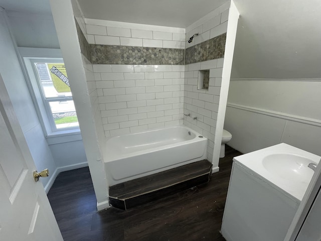 301 Michigan Ave, Bay City, MI 48708 - full bathroom with toilet, wood finished floors, vanity, bathing tub / shower combination, and baseboards
