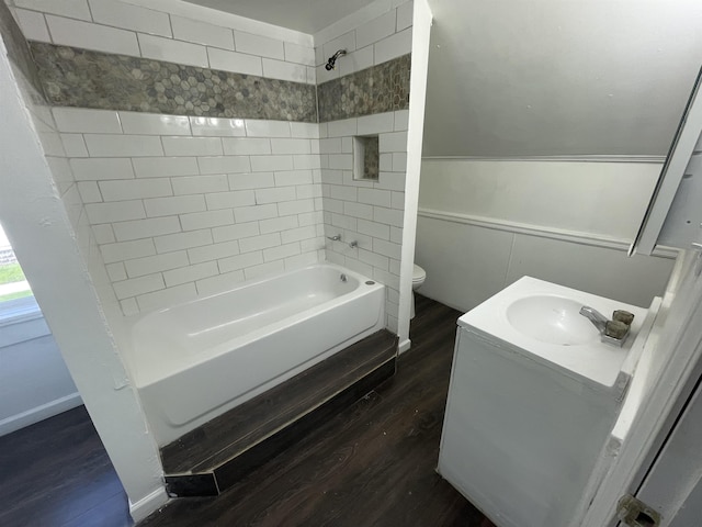 301 Michigan Ave, Bay City, MI 48708 - full bathroom with vanity, toilet, wood finished floors, and shower / bath combination