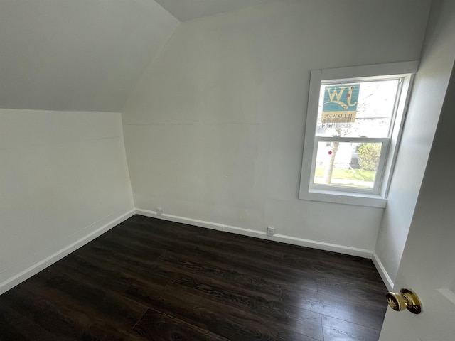 301 Michigan Ave, Bay City, MI 48708 - bonus room with dark wood finished floors, baseboards, and lofted ceiling