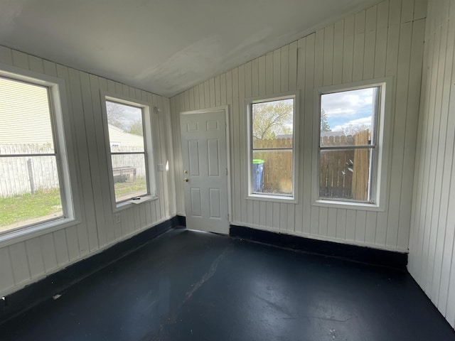 301 Michigan Ave, Bay City, MI 48708 - spare room featuring a healthy amount of sunlight, concrete floors, and vaulted ceiling