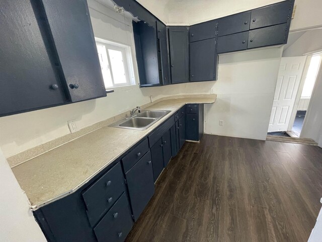 301 Michigan Ave, Bay City, MI 48708 - kitchen with a sink, light countertops, and dark wood finished floors