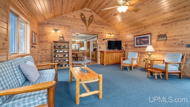 living room with wood walls, wood ceiling, and a healthy amount of sunlight