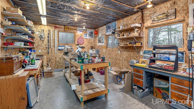 office area with concrete flooring and a workshop area