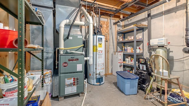 utility room with heating unit and gas water heater