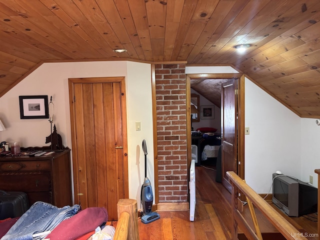 bedroom with wood ceiling, lofted ceiling, and hardwood / wood-style floors