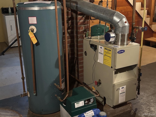 utilities featuring water heater and washer / clothes dryer