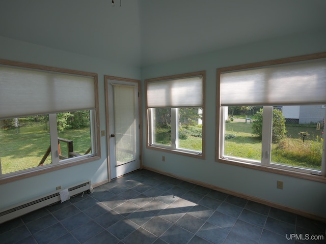 unfurnished sunroom with baseboards, baseboard heating, and tile patterned floors