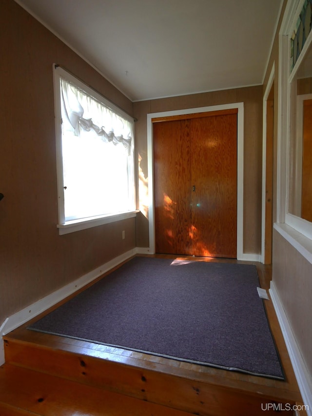 interior space featuring baseboards
