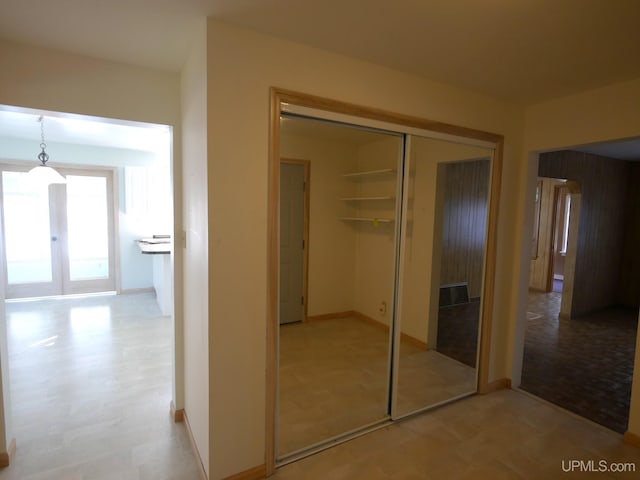 interior space featuring baseboards and french doors