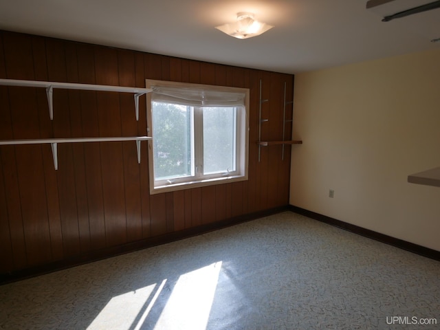 spare room featuring baseboards