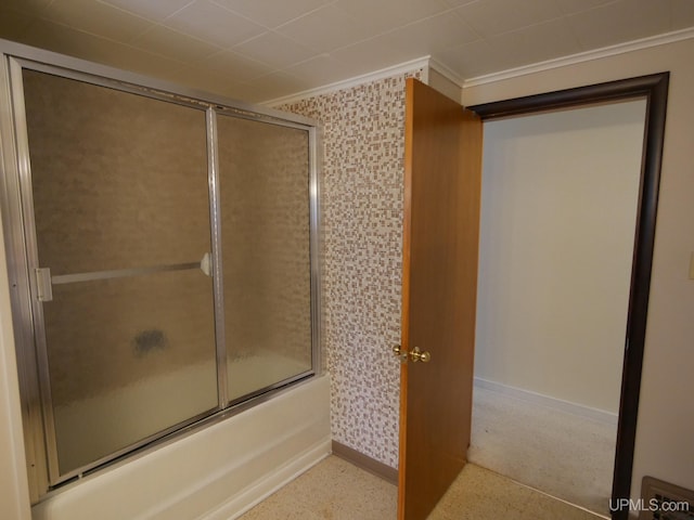 bathroom featuring crown molding, combined bath / shower with glass door, baseboards, and wallpapered walls