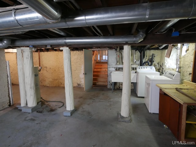 unfinished basement with independent washer and dryer