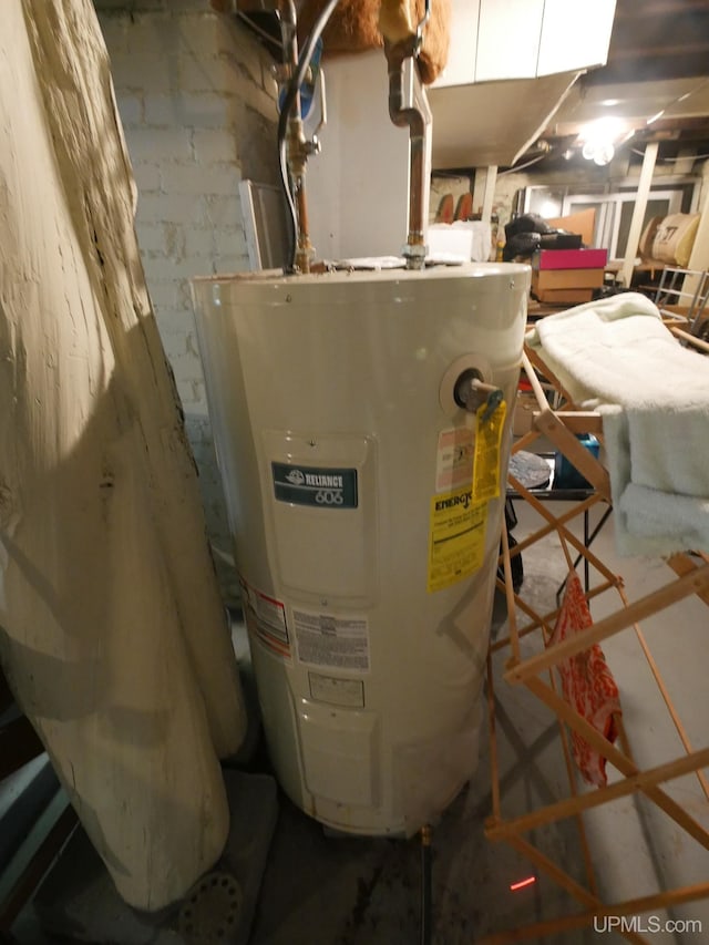 utility room featuring water heater