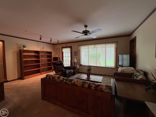 living area featuring track lighting, light carpet, a ceiling fan, and ornamental molding