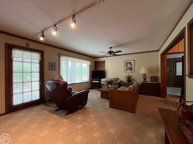 living room with light carpet, ornamental molding, ceiling fan, and track lighting