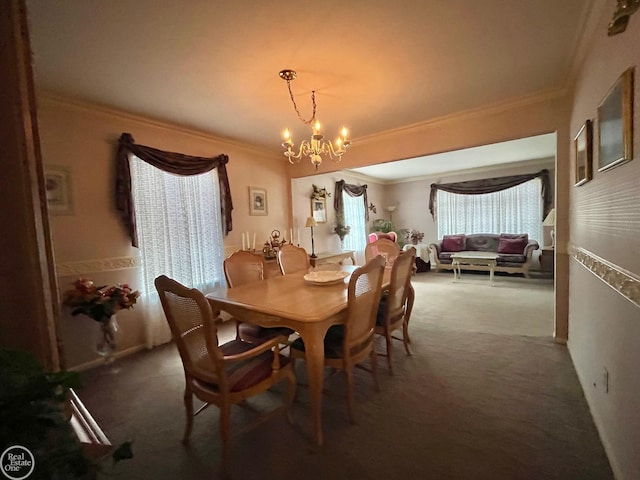 dining area featuring ornamental molding, carpet floors, and a notable chandelier