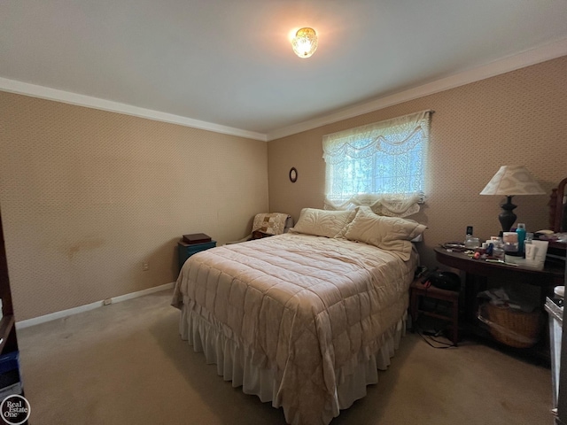 bedroom with baseboards, ornamental molding, and carpet floors