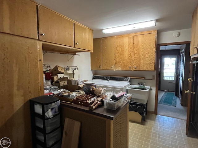 kitchen featuring washer and clothes dryer