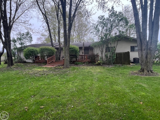 view of yard featuring a wooden deck