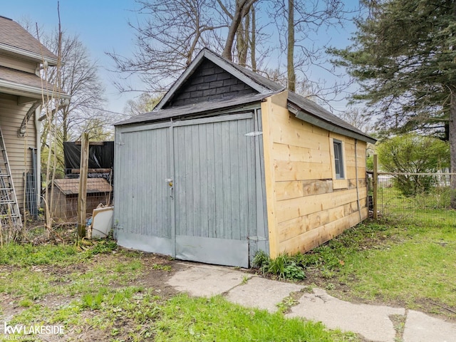 view of shed with fence