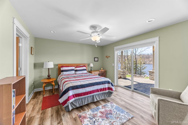 bedroom featuring recessed lighting, access to outside, baseboards, and wood finished floors