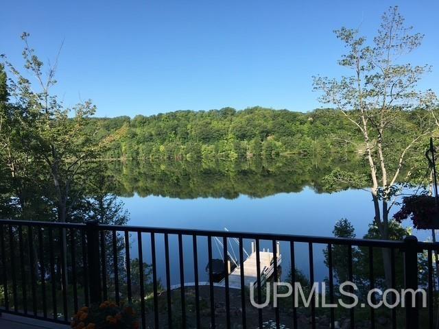 water view featuring a wooded view