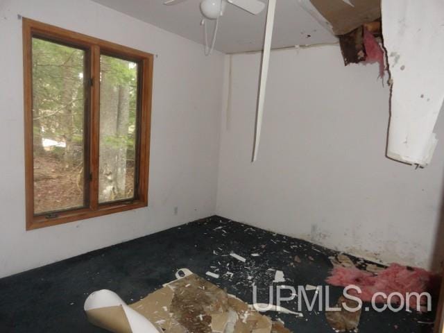 spare room with ceiling fan