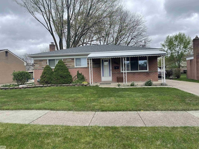 ranch-style house with a chimney, a front yard, and brick siding