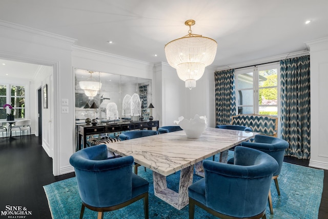 dining space with dark wood-style flooring, ornamental molding, a notable chandelier, and recessed lighting