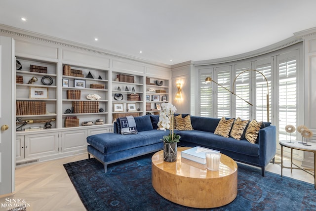 living area with ornamental molding, visible vents, and built in features