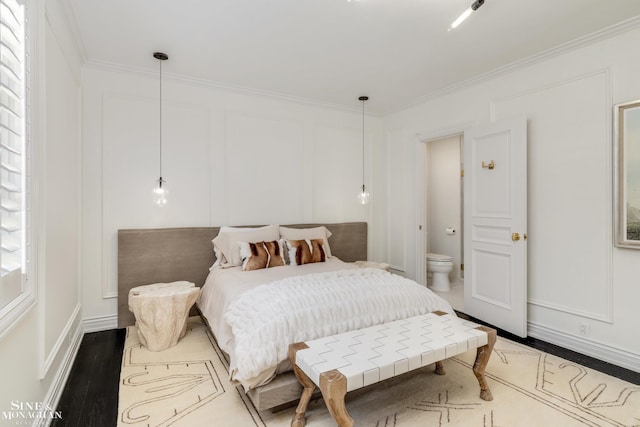 bedroom with baseboards and ornamental molding
