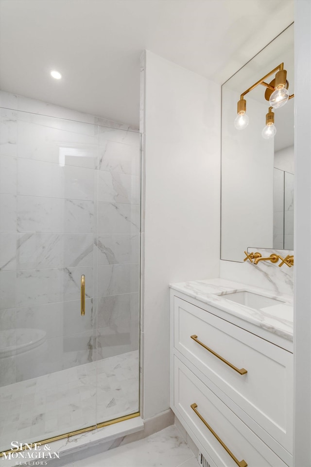 full bathroom with vanity, marble finish floor, a stall shower, and recessed lighting
