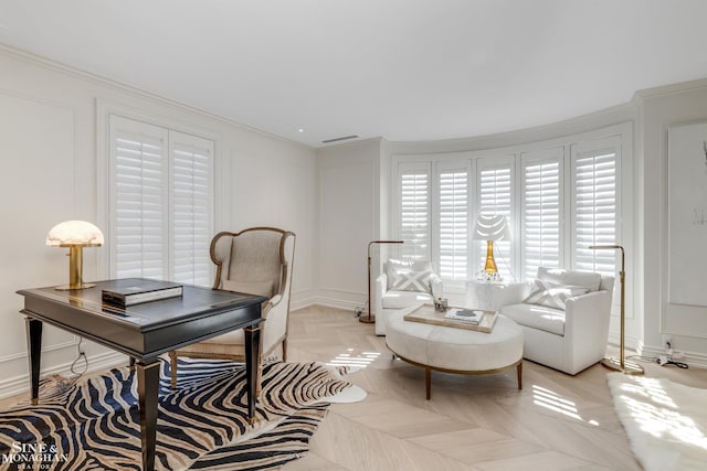 home office featuring crown molding, visible vents, and a decorative wall