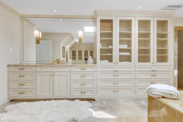 bathroom with vanity and visible vents