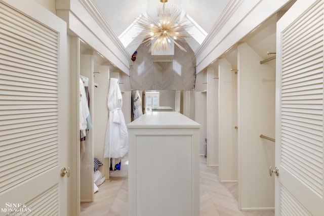 walk in closet featuring an inviting chandelier