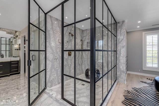 full bath featuring walk in shower, vanity, and ornamental molding