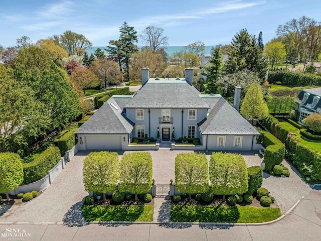 view of front of property with fence private yard, a garage, stucco siding, and driveway