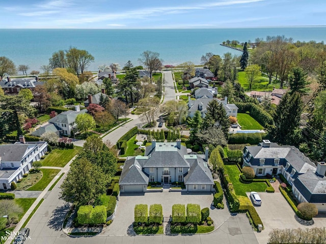 birds eye view of property featuring a water view and a residential view