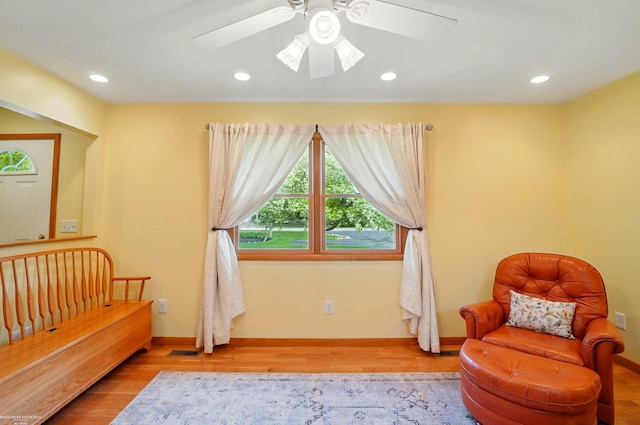 sitting room with wood finished floors, baseboards, ceiling fan, and recessed lighting