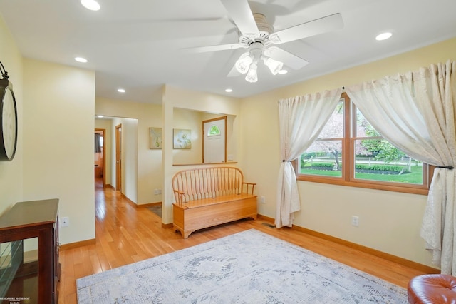 bedroom featuring wood finished floors, baseboards, and recessed lighting