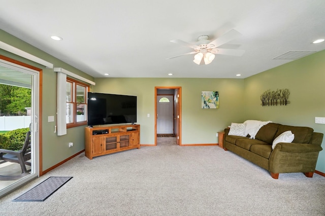 living area with visible vents, baseboards, ceiling fan, light carpet, and recessed lighting