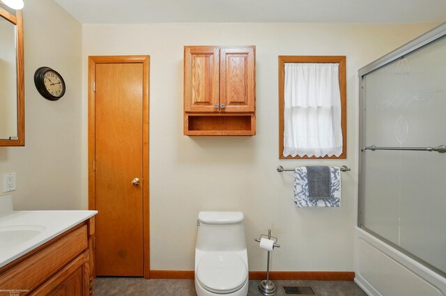 bathroom featuring toilet, baseboards, vanity, and visible vents