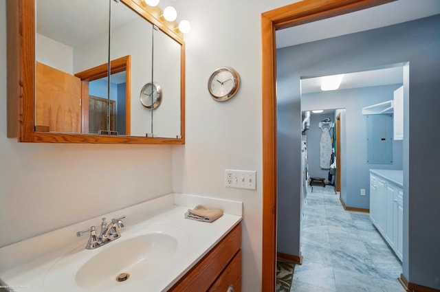 bathroom featuring vanity and baseboards