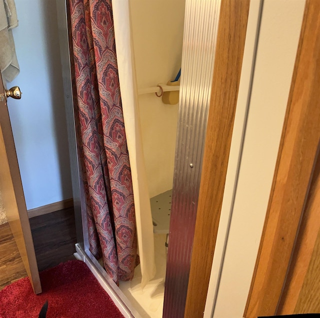 full bath featuring a shower stall