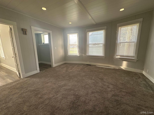 carpeted empty room with baseboards, plenty of natural light, and recessed lighting