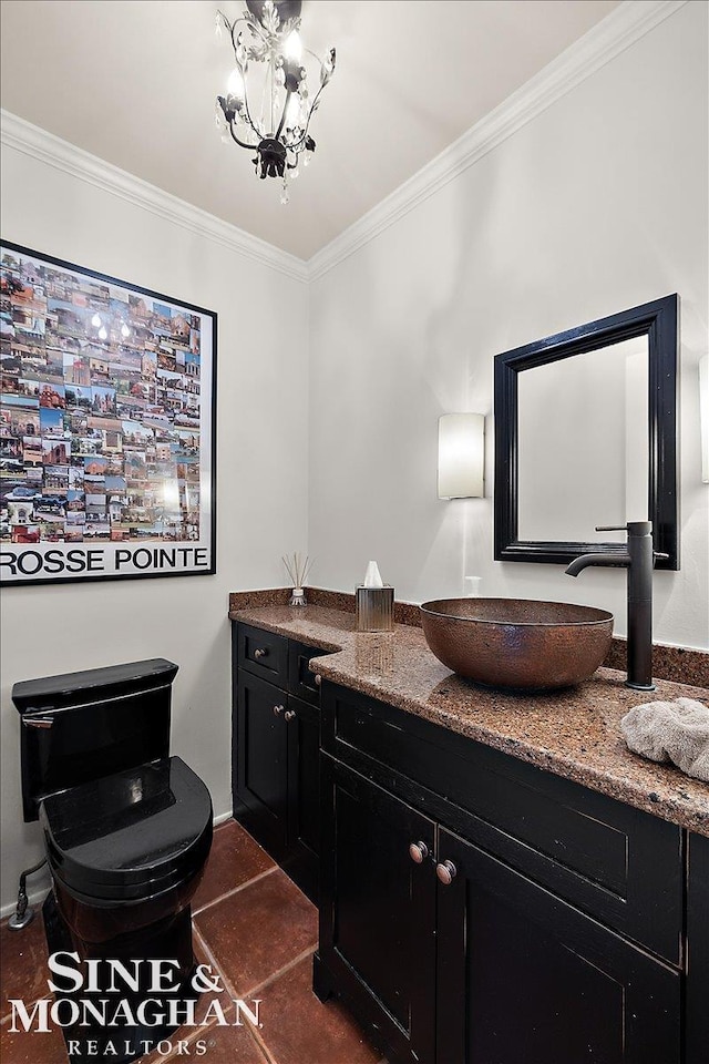 bathroom with crown molding, vanity, a chandelier, baseboards, and tile patterned floors