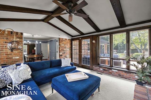 living room with carpet, brick wall, ceiling fan, a chandelier, and french doors