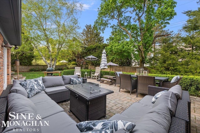 view of patio / terrace with an outdoor hangout area, outdoor dining area, and a fenced backyard