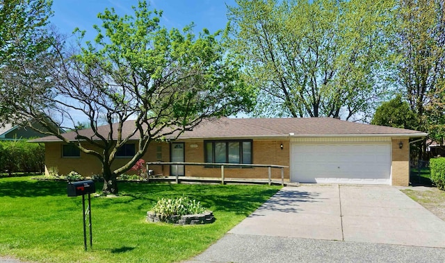 ranch-style home featuring a garage, concrete driveway, a front yard, and brick siding