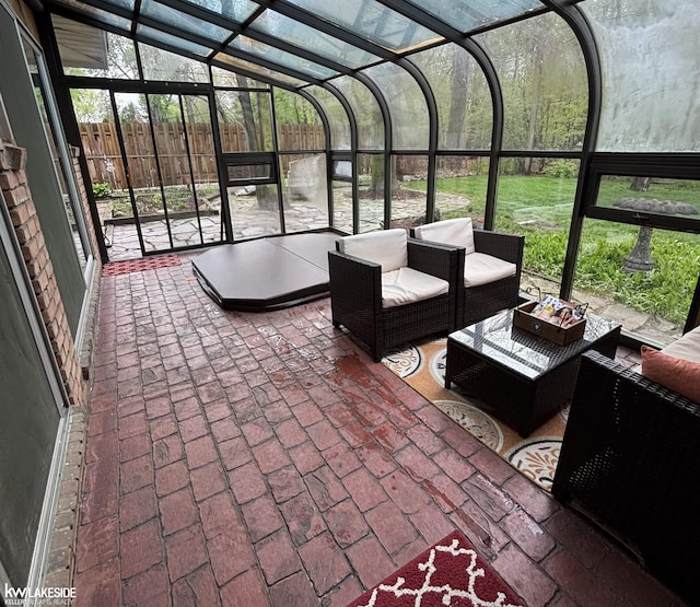 sunroom / solarium featuring outdoor lounge area